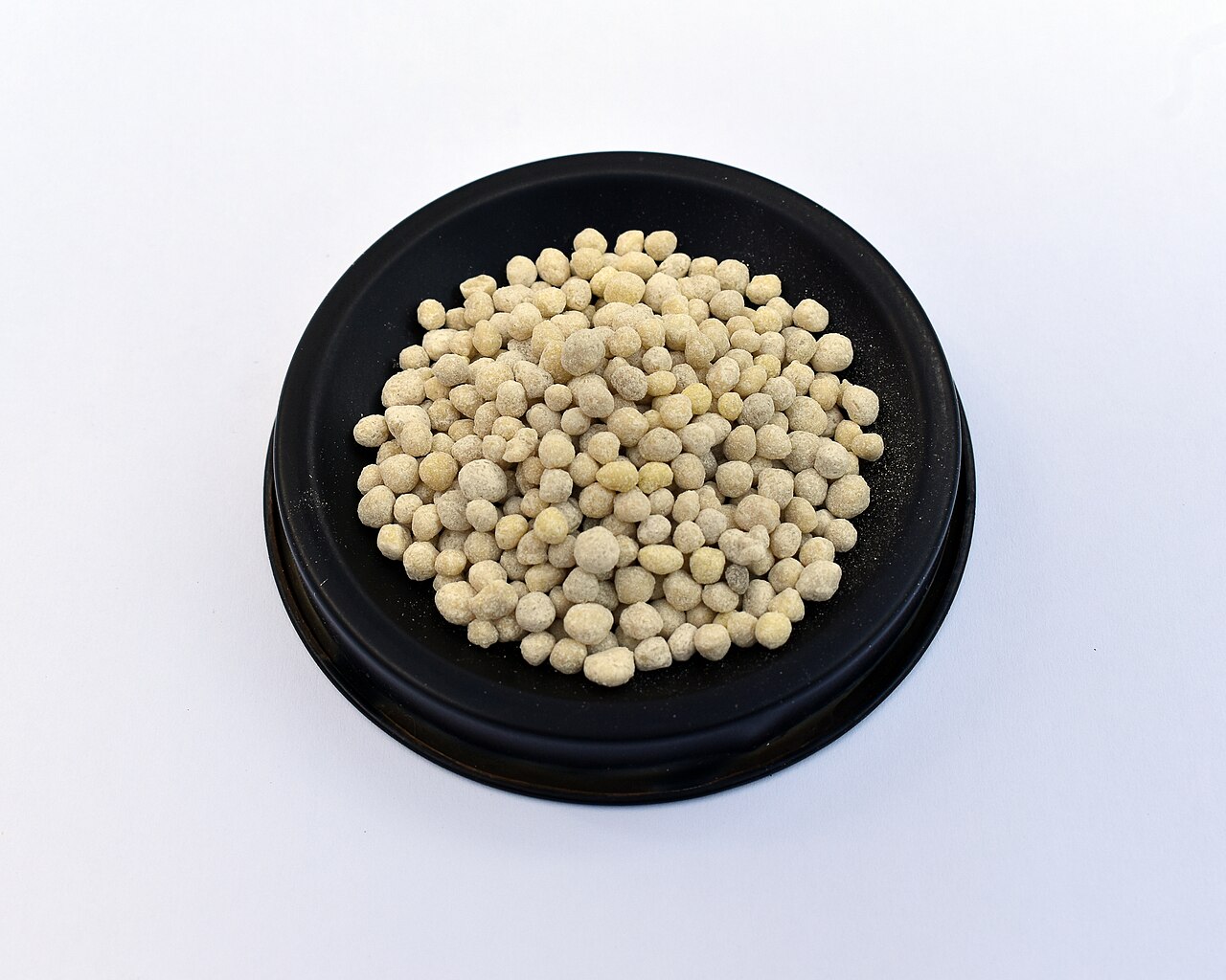 Mineral fertiliser granules in a sample dish